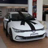 Large black satin car bonnet bow for car dealership vehicle presentations and gift vehicle displays